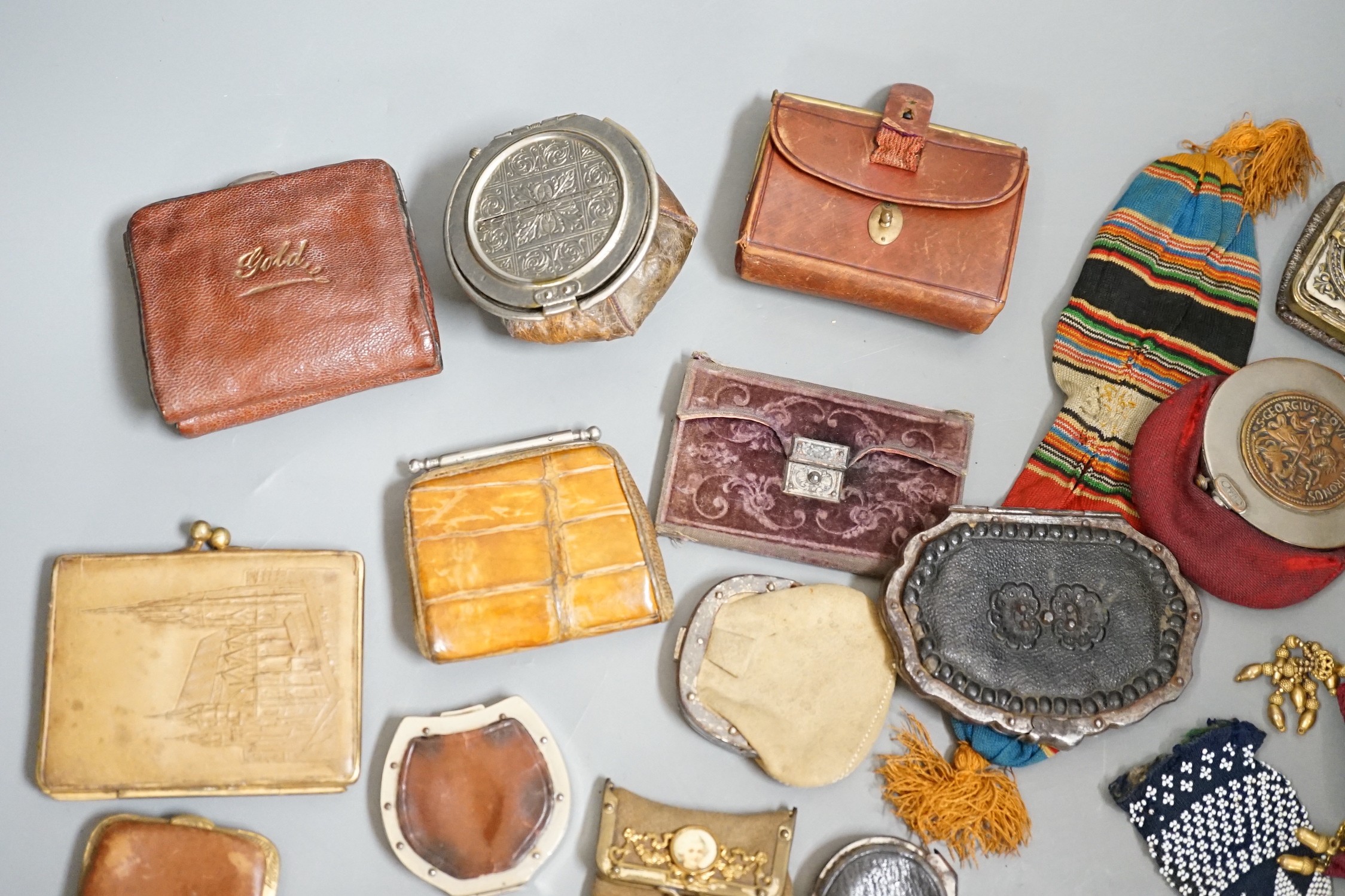 Mixed collection of mainly 19th century leather purses of various sizes and shapes, including two novelty ‘owl’ purses, a horse shoe shaped silver framed purse, cut steel purses, approx 39 in total